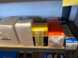 many boxes on a shelf in a room