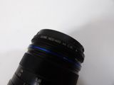a close up of a camera lens on a white surface