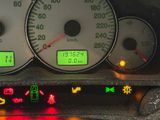 a close up of a car ' s dashboard with various gauges