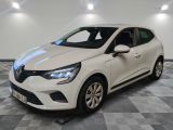 a white car parked in a garage with a checkered floor