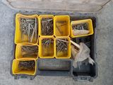 a tool box full of screws and other tools on the floor