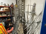 a room with a bunch of wires and a blue door
