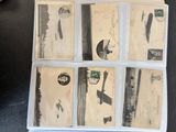 a box full of old postcards sitting on a table