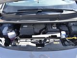 the engine of a car with its hood open and the hood down