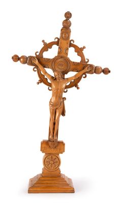 an antique wooden crucifix with a cross on a stand