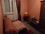 a bedroom with a bed and a dresser in it