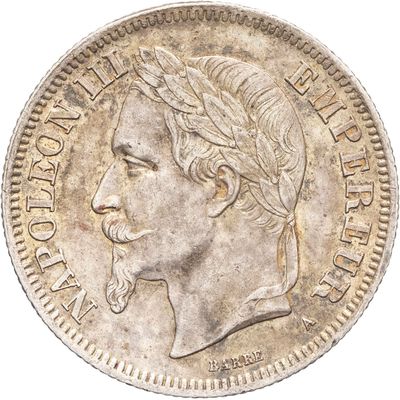 Gros plan sur une pièce de monnaie portant le visage d'un homme
