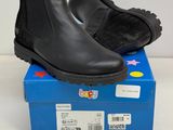 the children ' s black boots are on top of a blue box