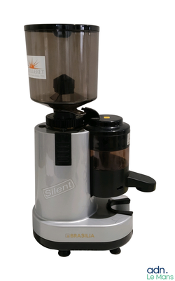 a silver and black coffee grinder on a white background