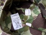 a close up of a camouflage jacket with a price tag