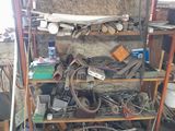 a shelf full of assorted items in a garage