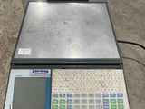 the electronic scale is sitting on the floor next to the floor
