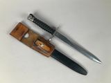 a knife and a knife holder on a table