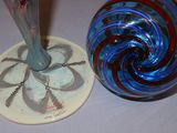 two glass vases sitting next to each other on a table