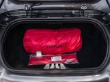 a red bag in the trunk of a car
