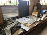 several pieces of metal sit on a pallet in a warehouse