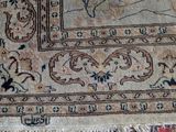 a close up of a rug with a cat laying on top of it