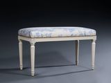 a white bench with a blue and white upholstered seat