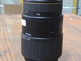 a camera lens sitting on top of a wooden table