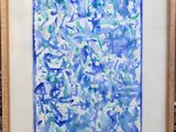 un tableau réalisé à la peinture bleue et verte, dans un cadre en bois