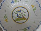 a white plate with a blue and yellow design on it