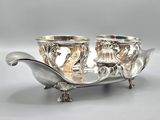 pair of silver plated candlestick holders with birds on them