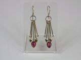 pink tourmaline and sterling earrings on clear acrylic stand