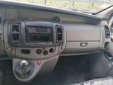 a dashboard of a car with a steering wheel and dashboard controls