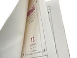a book that is open on a white surface