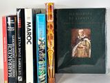 many books that are sitting on a shelf together
