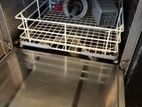 a dishwasher that is sitting inside of an oven