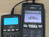 two electronic devices sitting next to each other on a table