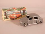 a toy car that is sitting next to a box