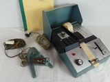 a small machine that is sitting next to a book