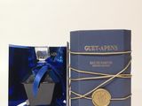 an image of a bottle of blue perfume in a blue box