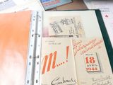 a binder that has a lot of papers on top of it