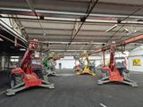 many machines that are parked inside of a building
