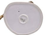 a white porcelain object with a gold handle on a white background