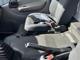 a seat in the back of a car with a cell phone in it
