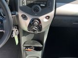 a car dashboard with a steering wheel and a dash board