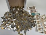 a box full of coins and money sitting on a table