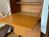 a wooden desk with a book shelf on top of it