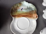 a plate with a picture of a man fishing on it