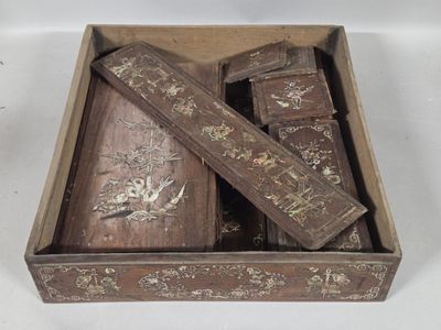 a wooden box with a bunch of wooden items inside of it