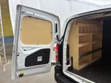 a white van with the door open and shelves in the back of it