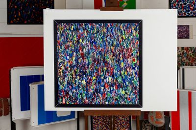 a picture of a painting on a easel in a room