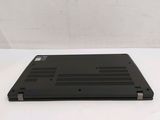 a black laptop that is sitting on a white surface