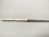 a close up of a pair of chopsticks sitting on top of a table