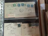 a box full of stamps and a book on top of a table