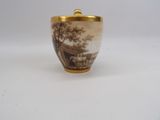 an image of a small cup with a picture of a farm scene on it